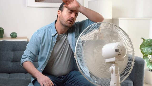 Video about man sweating suffering summer heatwave at home