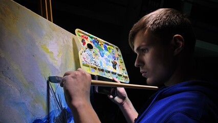 Artist copyist paint seascape with ship in ocean. Craftsman decorator draw as boat sail on blue sea with acrylic oil color. Draw finger, brush, knife palette. In hand of cellphone tablet computer pc.