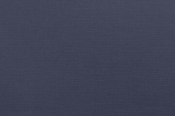 Dark blue design paper background with linen texture. Blank sheet of decorative cardboard with copy space