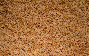 Brown whole grain rice background texture.