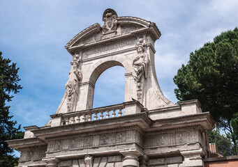 Fototapeta na wymiar Palatine Hill main entrance gate arch in Rome, Italy. Horti Palatini Parnesiorum.