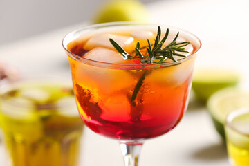 Glass of tasty pomegranate cocktail on table, closeup