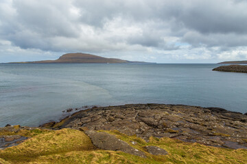 Fototapeta na wymiar Steep coast of the island of Streymoy. Faroe Islands.
