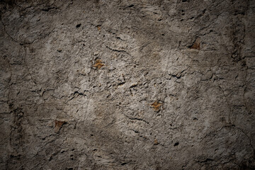 Damaged old rustic concrete wall surface with cracks