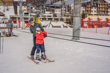 Instructor teaches boy skier to use on ski lift
