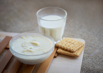 milk soup with vermicelli, cookies and a glass of dairy product.