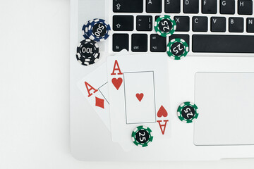 Playing cards on laptop keyboard. Online poker concept