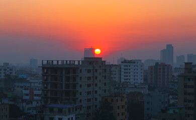 Fototapeta premium Sunset or sunrise at the city with building silhouette. Sunrise cityscape. Copy space.
