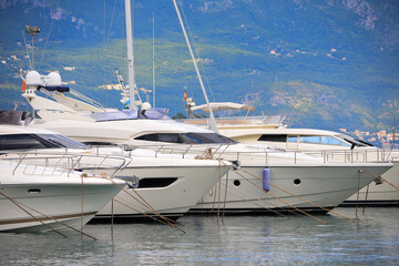Fototapeta premium Luxury yachts and boats moored in the Dukley Marina in Budva