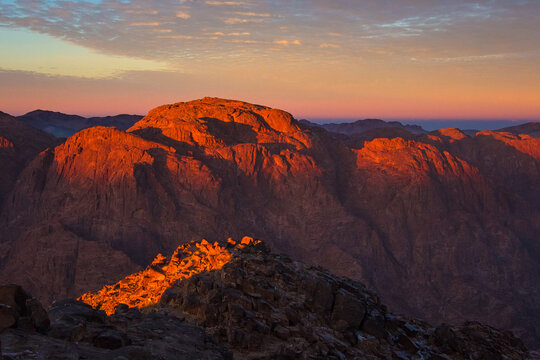 Sunrise on the summit of the Mount Sinai (Mount Horeb, Holy Mount Moses or Gabal Musa), Egypt, North Africa. Low exposure