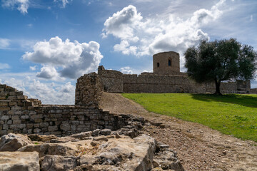 view of the castle of Jimena de la Frontera under an expressive sky