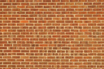 Wall with red / orange bricks. Abstract background