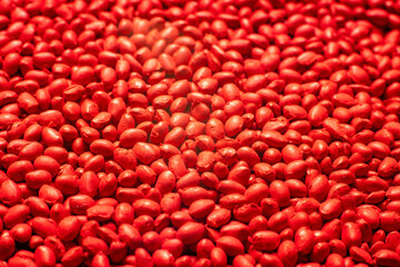 Red polymer dye in granules, background texture