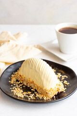 Banana cake with white chocolate on a white background. Fruity malaga cake. close up