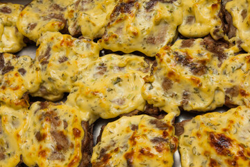 Baked beef fillet in cheese and spices close-up. Beef steaks.
