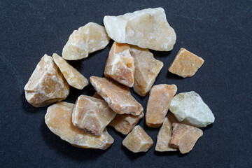 Granites are coarsely crystalline plutonic rocks rich in quartz and feldspar, but also contain dark...