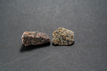 Granites are coarsely crystalline plutonic rocks rich in quartz and feldspar, but also contain dark...