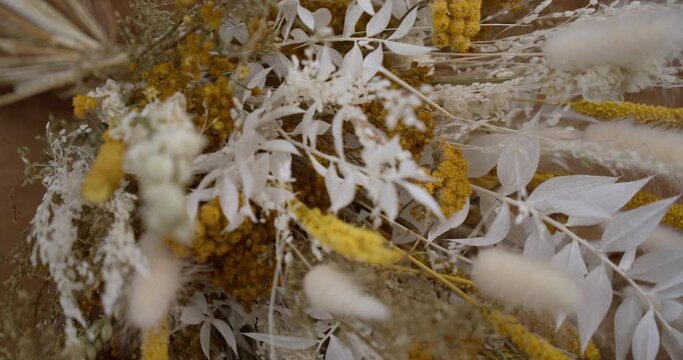 Boho Flower Bouquet In White And Yellow With Bunny Tails. close up