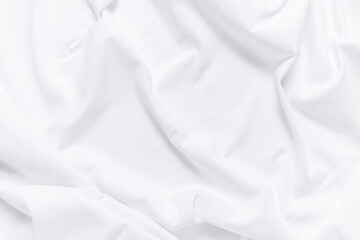 Fototapeta premium White fabric texture background. Cloth soft wave. Creases of satin, silk, and cotton.
