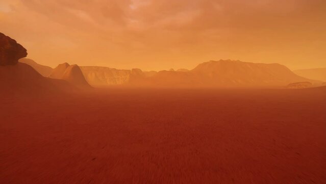A low flying aerial view over the red surface of the planet Mars with all its mountains, valleys and canyons.