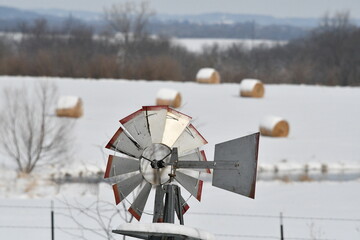 Windmill in a Hay Field