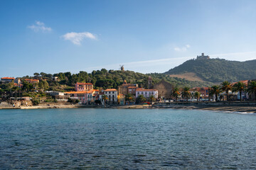 Fototapeta na wymiar Collioure view from the other side of the bay with Fort of Saint Elme on the top of the village and the beach
