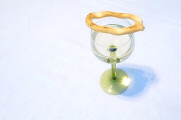 Savory biscuits on a glass of white wine