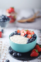 Milk rice with berries ready for breakfast