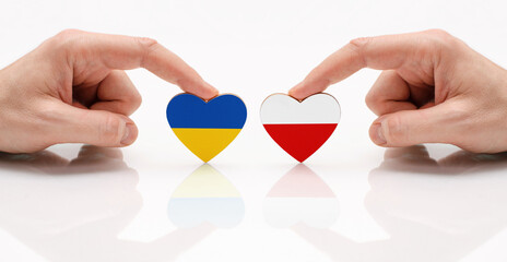 The concept of friendship and diplomatic relations between Poland and the Ukraine. Two male hands...