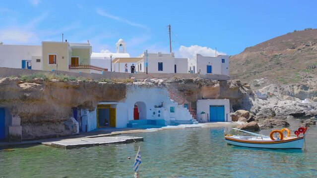 Traditional seafront greek fishing houses on Mandrakia beach, Milos island, Greece