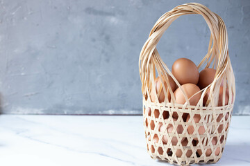 fresh chicken eggs in bamboo basket
