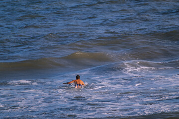 Surfing a wave in the sea 