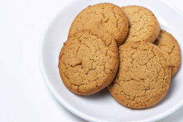 Oatmeal cookies on a white background. Light and tasty dessert. Healthy breakfast
