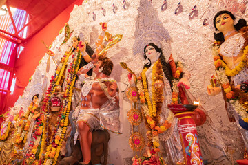 Goddess Durga idol at decorated Durga Puja pandal, at Kolkata, West Bengal, India. Durga Puja is...
