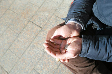 hands of old beggar