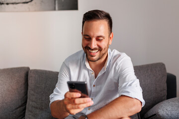 Man chatting online using mobile phone