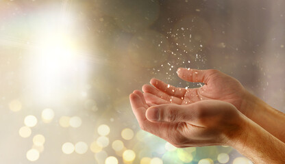 Praying religious hands concept with glitters and lights background