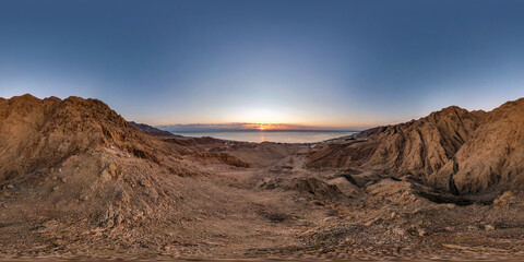 Fototapeta na wymiar full seamless spherical hdri 360 panorama view of dawn on coast of sea high in sandy mountains with morning sun in equirectangular projection, ready for VR AR virtual reality