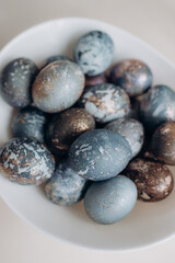 Fototapeta na wymiar Unusual Easter eggs in blue shades with gilding