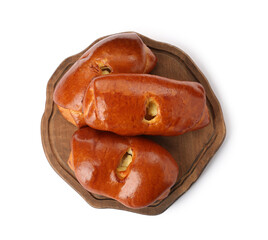 Wooden board with delicious baked patties on white background, top view
