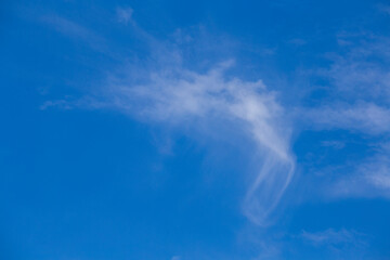 White clouds on a blue sky background