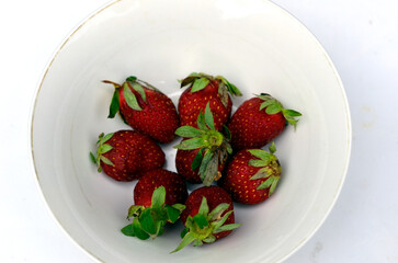 Strawberry in white bowl photo