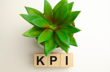 Fototapeta na wymiar Word KPI Key performance indicator, made with wood building blocks