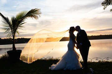 wedding  silhouette sunset over lake