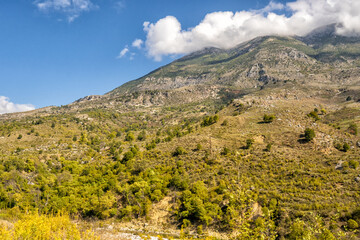 Beautiful mountain valley with gentle hills and clouds
