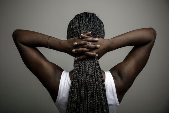 Rear View Of Confident Beautiful Young African American Woman With Long Black Braids