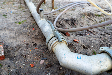 Wellpoint installation to get rid of high groundwater, visible steel tube with a latch.