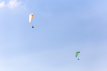 Paraplaners with beautiful blue sky and clounds in the background