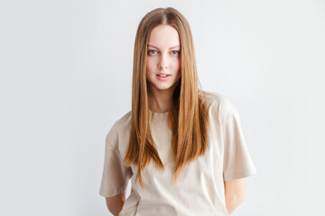 Portrait of young beautiful cute cheerful girl smiling over white background