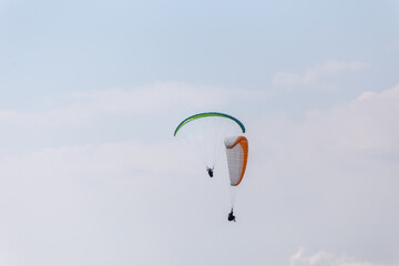 Paraplaners with beautiful blue sky and clounds in the background